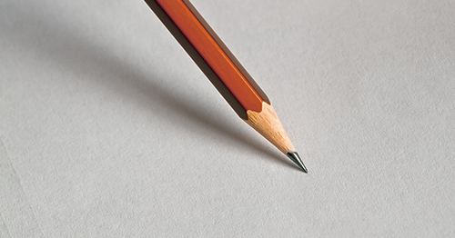 Foto Ein Bleistift auf einem Blatt Papier
